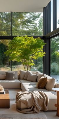 Modernist armchairs and sculptural lighting fixtures add visual interest to the contemporary living room.