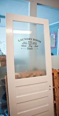 See how Gaspard Travels and Life transformed a reclaimed door with Artscape Etched Glass peel and stick and a decal purchased from Etsy to create a fabulous door for her laundry room.