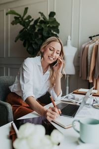 Fashion designer on the phone in the studio | free image by rawpixel.com / McKinsey | Headshots | Marketing | Women | Female | Branding | Headshot photography | Posing ideas for headshot | headshot inspiration | portrait | personal branding | professional photo | #headshot #portrait #professionalportrait #professionalphotos #headshot #lifestyle #photography #portrait #personalbranding #professional #corporatephoto #headshots #corporateheadshot #corporate #creative