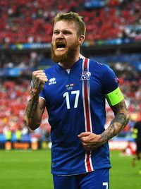 Aron Gunnarsson of Iceland celebrates his team's victory in the UEFA EURO 2016 Group F match between Iceland and Austria at Stade de France on June...
