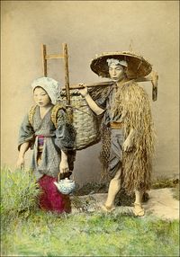 https://flic.kr/p/7ADxzi | Japanese Farmers | A staged 19th century photograph of a farmer and his wife. The man wears the traditional straw rain coat ( 蓑, mino) and kasa (笠), a hat made of bamboo or sedge. Unidentified photographer. Note that there is a small number close to the left foot of the farmer. It is blotted out, but still visible. Maybe an early pirated view? Although this is only a small sized albumen print, the coloring is very precise. (Photographer probably Kusakabe Kimbei)