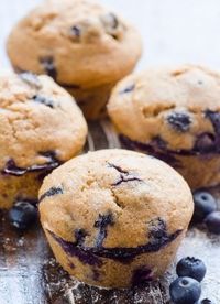 Clean Eating Blueberry Muffins -- Fantastically delicious and light, made with spelt or whole wheat flour and applesauce.