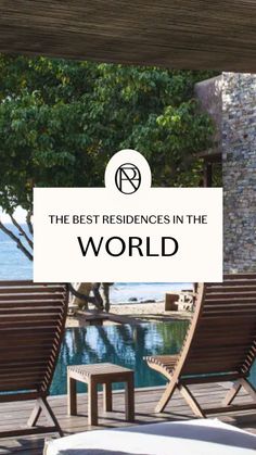 two wooden chairs sitting on top of a deck next to a pool with the words best residence in the world