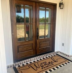 a welcome mat is on the front door