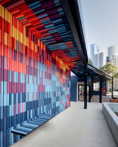 a building with colorful tiles on the side