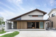 a modern house with an open patio and sliding glass doors on the front door is shown