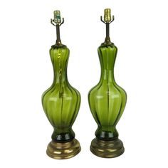 two green vases sitting next to each other