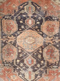 an old rug with many different colors and patterns on it's sides, including the center