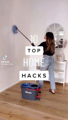 a woman is cleaning the floor with a mop in her hand and text overlay reads 10 top home hacks