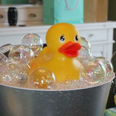 a rubber duck in a tub filled with bubbles