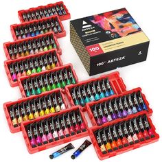 an assortment of art supplies including markers, pens and glues in red plastic cases