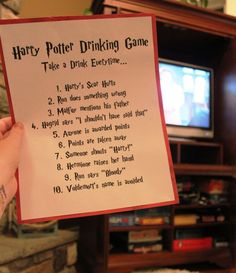 a harry potter drinking game is held up in front of a tv with the words harry potter drinking game written on it
