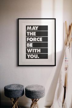 two stools in front of a poster with the words may the force be with you