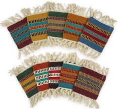 four pieces of multicolored woven material with fringes