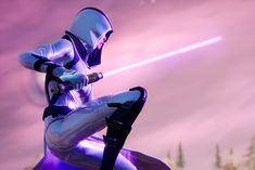 a person with a light saber in their hand sitting on a purple chair and looking at the sky