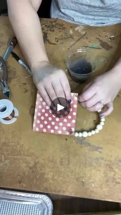 a person is making something out of paper