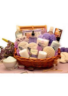 a basket filled with lots of different types of soaps and lotions on top of a table