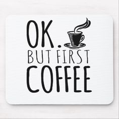 a black and white mouse pad with the words ok but first coffee