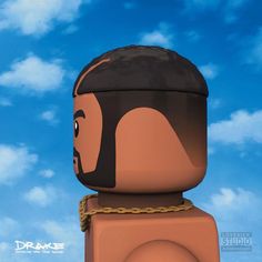 there is a lego man with a chain around his neck and face on the head