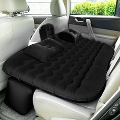 an inflatable car seat cushion sitting on the back of a car