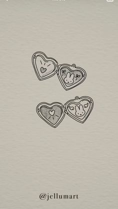 two heart shaped cookies sitting on top of a white paper with the words jellymart written