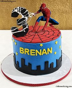 a spiderman themed cake is on display