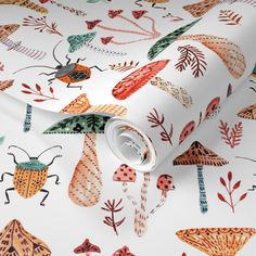 a white wallpaper with colorful bugs and leaves on it's surface, as well as an insect design