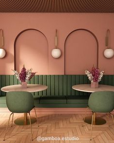 two tables with chairs and vases on them in front of a pink walled wall