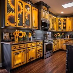 the kitchen has sunflowers painted on it and is yellow with black trimming