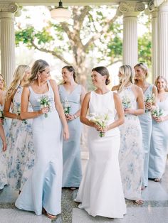 a group of women standing next to each other in front of a white gazebo