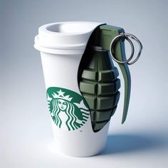 a starbucks coffee cup with a carafe keychain attached to it