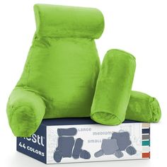 a green recliner sitting on top of a box