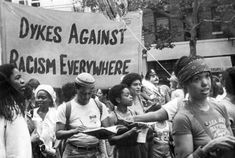 black and white photograph of people protesting against racism