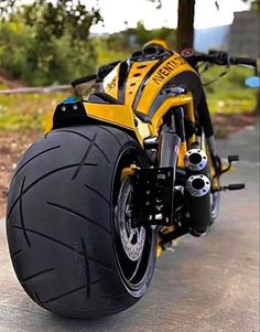 a yellow and black motorcycle parked on the street