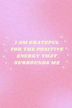 i am grateful for the positive energy that surrounds me written in white on a pink background