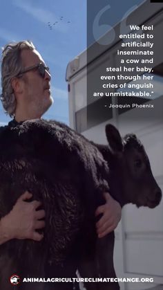 a man holding a baby goat in his arms with a quote from jean paul phenis