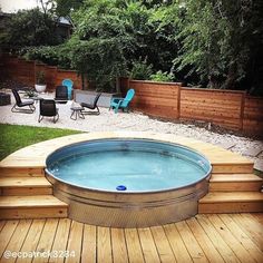 a hot tub sitting on top of a wooden deck