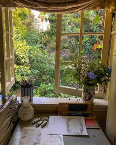 an open window in a room filled with lots of plants and books on top of a table