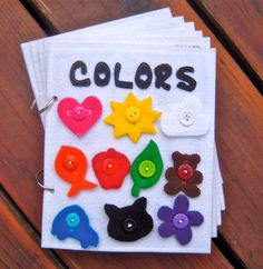 a book with buttons on it sitting on top of a wooden table