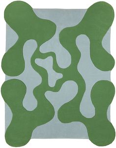 a green and blue rug with wavy shapes
