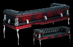 an ornate red and black leather bench with matching footstools is shown in front of a black background