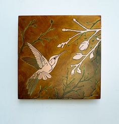 a painting on a white wall with a bird flying over the tree branch and flowers