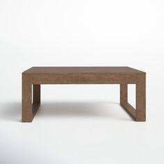 a wooden table sitting on top of a white floor