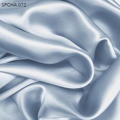 an image of a silk fabric textured in shades of blue and white or silver