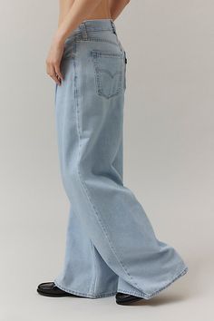 Vintage-inspired Dad jeans from Levi’s® with a perfectly broken-in feel. Cut in a mid-rise silhouette with a slouchy straight leg that puddles at the hem. Features Levi’s® dad jeans a mid-rise and a loose and relaxed wide-leg Crafted from rigid denim that will soften over time Logo patch at the back Zip fly Content + Care 100% Cotton Machine wash Imported Size + Fit Mid rise Wide leg Full length Model in Light Blue is 5’8" and wearing size 27 Measurements taken from size 28 Rise: 10.5" Inseam: 32" Leg opening: 26" | Levi's Novel Baggy Dad Jean in Light Blue, Women's at Urban Outfitters Oversized Jeans Aesthetic, Light Blue Baggy Jeans Outfit, Baggy Dad Jeans Outfit, Light Baggy Jeans, Levis Baggy Jeans, Baggy Light Wash Jeans, Light Blue Baggy Jeans, Wide Jeans Outfit, Blue Jeans Wide Leg