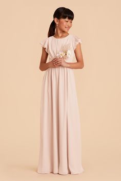 This sweet ruffle-sleeved dress is a dream for a junior bridesmaid. This design features a waistband tie in back for juniors who are between sizes. Older Flower Girls, Bridesmaid Separates, Junior Dress, Blush Pink Bridesmaid Dresses, Junior Bridesmaids, Birdy Grey, Pink Flower Girl Dresses, Pink Long Dress, Blush Bridesmaids