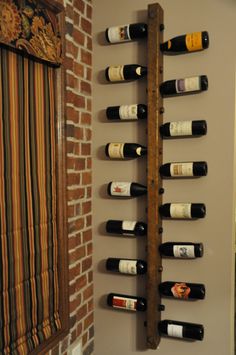 a wine rack is mounted to the wall