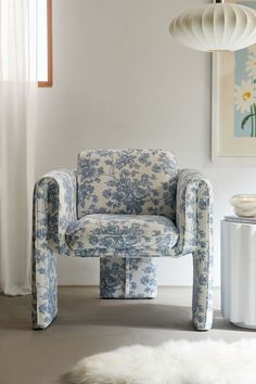 a blue and white chair sitting in a living room