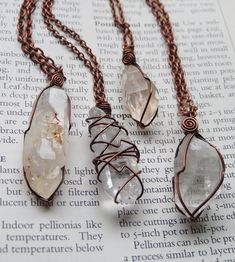 A selection of 4 totally magical and uniquely wrapped raw quartz crystal necklaces. Each wrapped in solid antiqued copper wire and strung on matching chain in your choice of length! Necklace A- Flat Clear Quartz Crystal Necklace B- Quartz with red iron inclusions and some cool crystal growth on one face!  Necklace C- Tangerine Quartz from Nova Scotia, has some peachy undertones Necklace D- Chunkier Clear Quartz Crystal Crystal Wire Wrapping, Crystal Necklace Diy, Crystal Jewelry Ideas, Jewelry Modeling, Wire Wrapped Crystal Necklace, Wrapped Crystal Necklace, Crystal Macrame, Tangerine Quartz, Crystal Growth