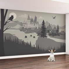 a dog sitting on the floor in front of a wall mural with a castle and forest scene